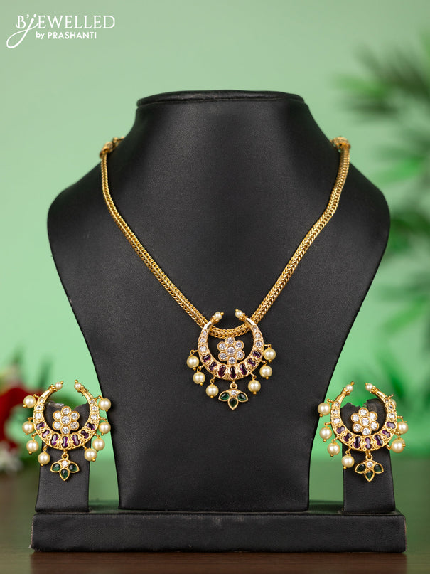 Attigai necklace with chandbali pendant in kemp,green stones and pearl hangings