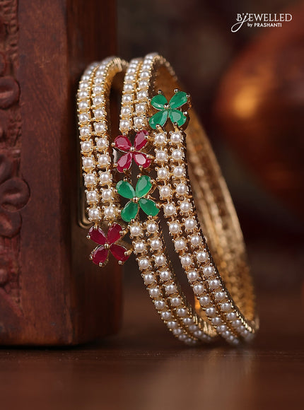 Pearl bangle with kemp stones and pearls in gold finish