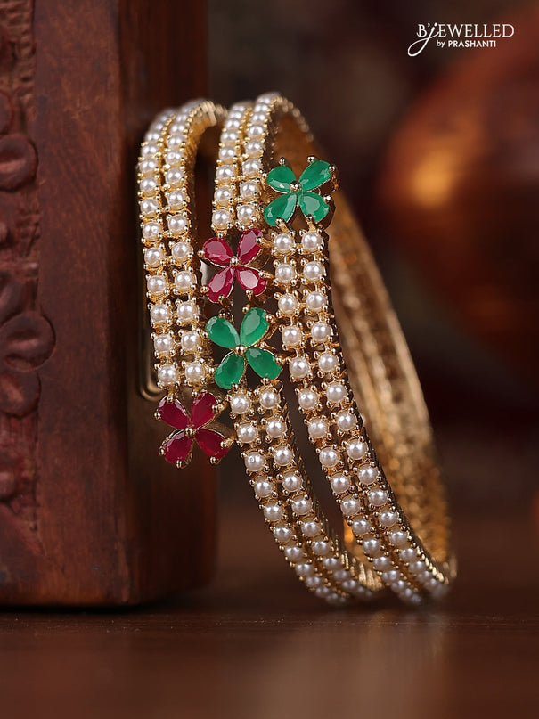 Pearl bangle with kemp stones and pearls in gold finish