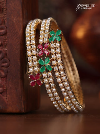 Pearl bangle with kemp stones and pearls in gold finish