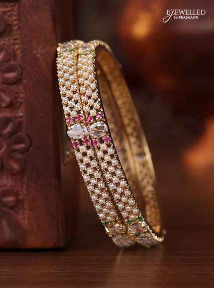 Pearl bangle with kemp stones and pearls in gold finish