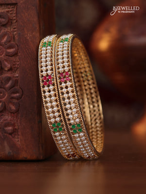 Pearl bangle with kemp stones and pearls in gold finish