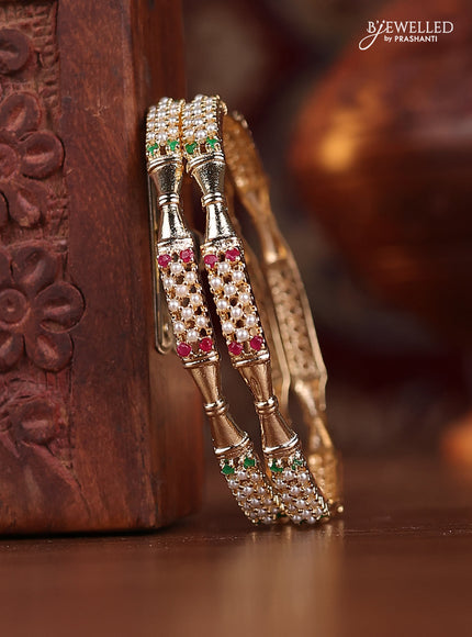 Pearl bangle with kemp stones and pearls in gold finish