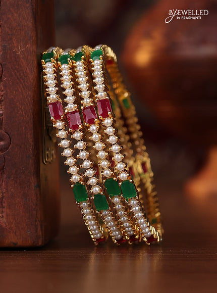 Pearl bangle with kemp stones and pearls in gold finish