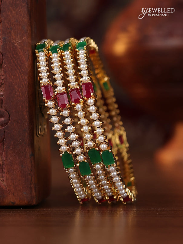 Pearl bangle with kemp stones and pearls in gold finish