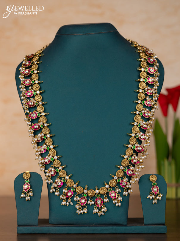 Jadau Haaram with lakshmi kaasu design in jadau kundan stones and rice pearl hanging