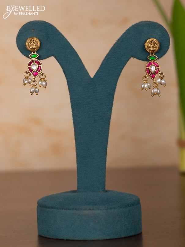 Jadau Haaram with lakshmi kaasu design in jadau kundan stones and rice pearl hanging