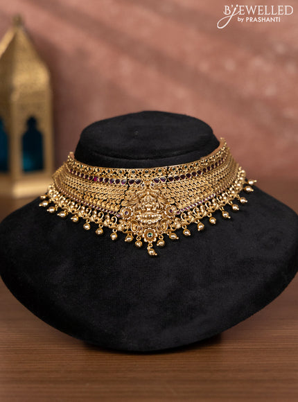 Antique choker lakshmi design with kemp stones and golden beads hangings