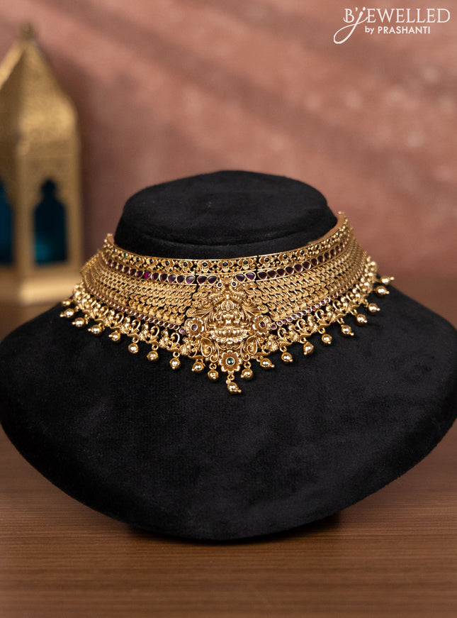 Antique choker lakshmi design with kemp stones and golden beads hangings