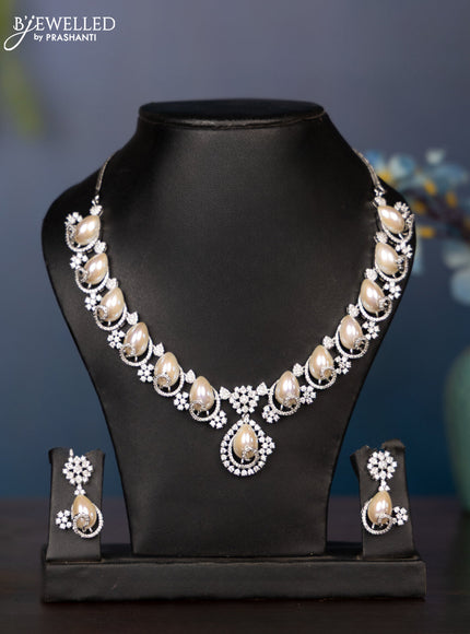 Zircon necklace with tear drop shape pearl embedded and covered in cz stones