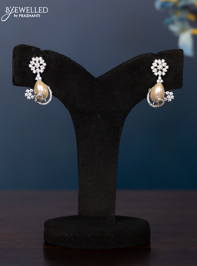 Zircon necklace with tear drop shape pearl embedded and covered in cz stones