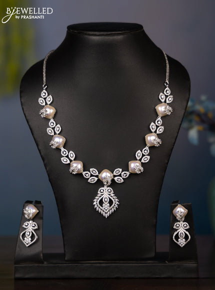 Zircon necklace with tear drop shape pearl embedded and covered in leaf shape cz stones