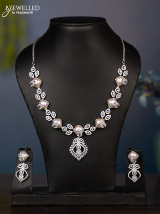 Zircon necklace with tear drop shape pearl embedded and covered in leaf shape cz stones