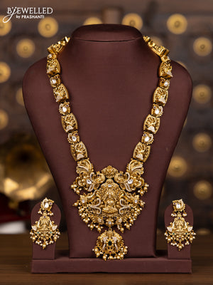 Antique haaram with lakshmi and elephant pendant design in kundan stones and pearl hanging