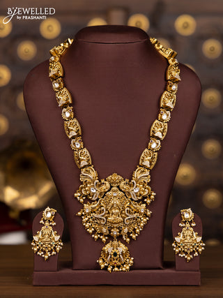 Antique haaram with lakshmi and elephant pendant design in kundan stones and pearl hanging