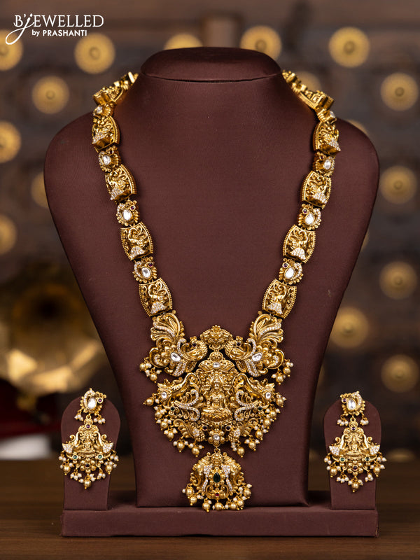 Antique haaram with lakshmi and elephant pendant design in kundan stones and pearl hanging