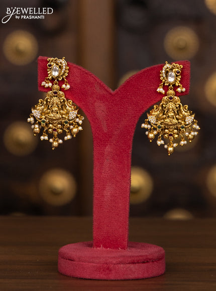 Antique haaram with lakshmi and elephant pendant design in kundan stones and pearl hanging
