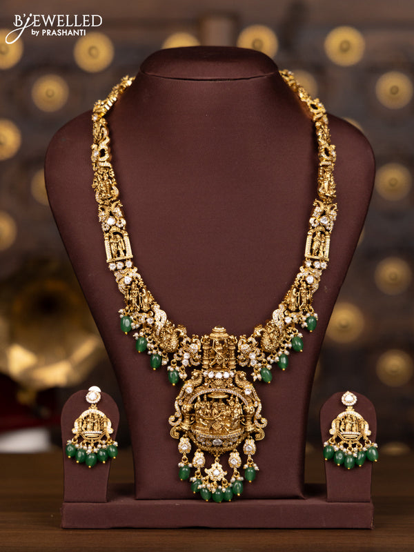 Antique haaram with 3D ram parivaar pendant in white stones and green beads hanging