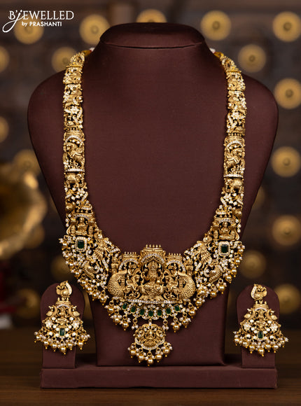 Antique haaram with lakshmi pendant with green and white stones and golden beads hanging