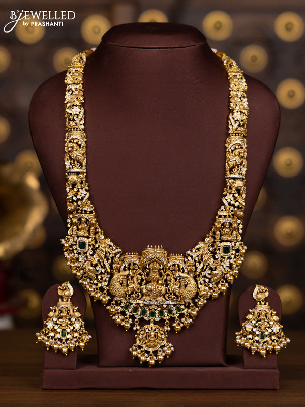 Antique haaram with lakshmi pendant with green and white stones and golden beads hanging