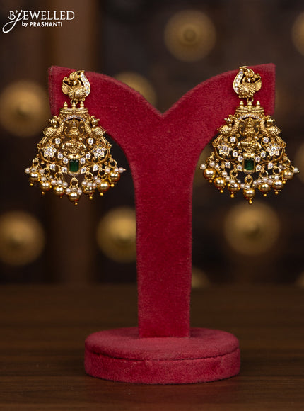 Antique haaram with lakshmi pendant with green and white stones and golden beads hanging