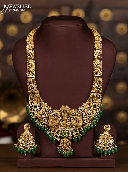 Antique haaram with lakshmi pendant with green and white stones and green beads hanging