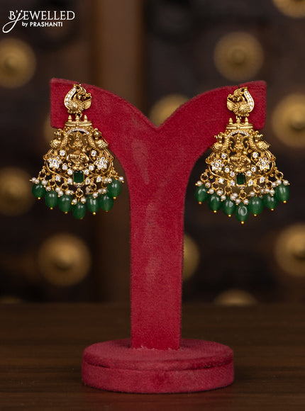 Antique haaram with lakshmi pendant with green and white stones and green beads hanging
