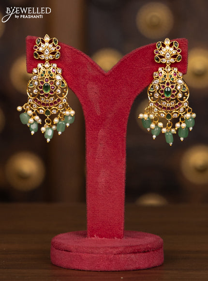 Antique haaram with floral design in multicolor stones and green beads hanging