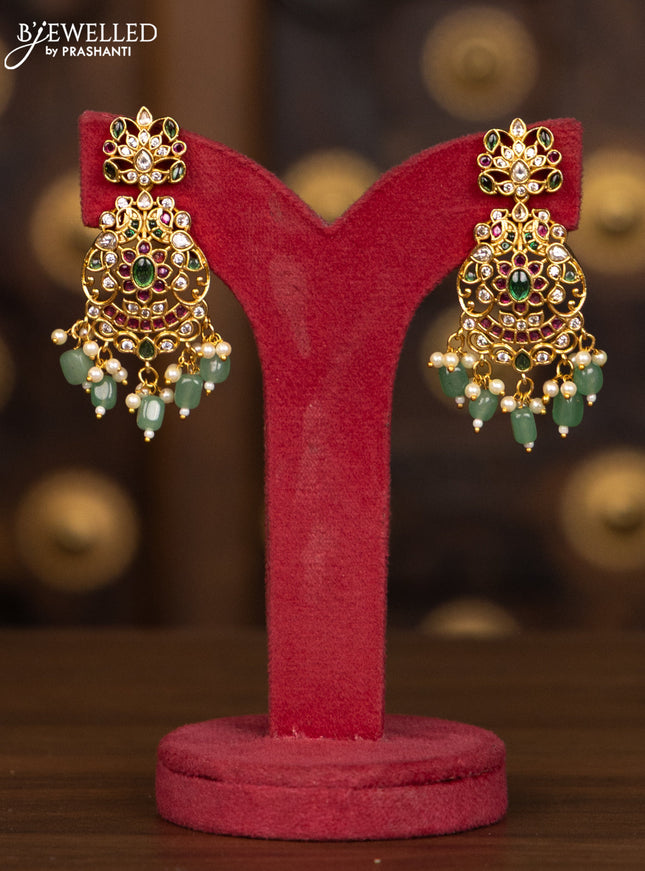 Antique haaram with floral design in multicolor stones and green beads hanging