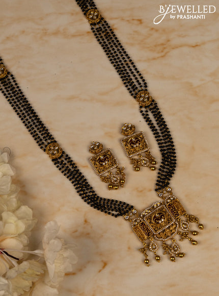 Mangalsutra long with ruby & kundan cz stones and golden beads hangings