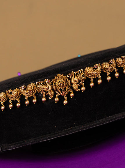 Antique hip chain peacock & floral deisgn in jadau kundan stones and golden ball hanging