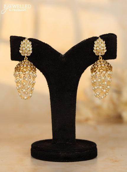 Antique medium size jhumka with leaf design in white stones and pearl hanging
