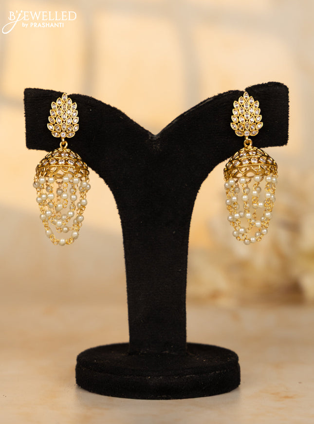 Antique medium size jhumka with leaf design in white stones and pearl hanging