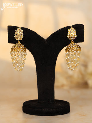 Antique medium size jhumka with leaf design in white stones and pearl hanging