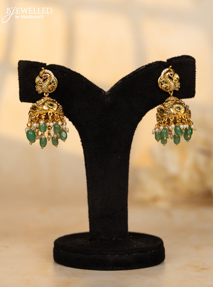 Antique jhumka peacock deisgn in red and green kemp stones and green beads hanging