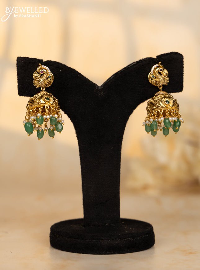 Antique jhumka peacock deisgn in red and green kemp stones and green beads hanging