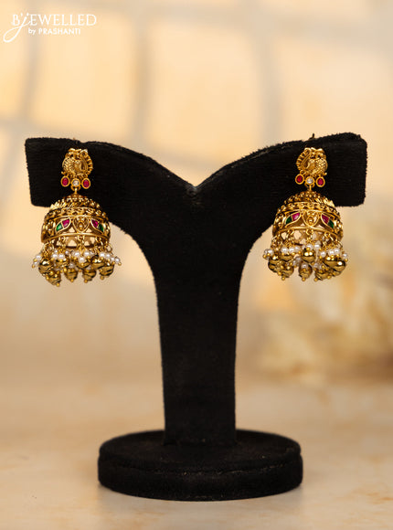 Antique jhumka peacock deisgn in jadau kundan stones and pearl golden ball hangings