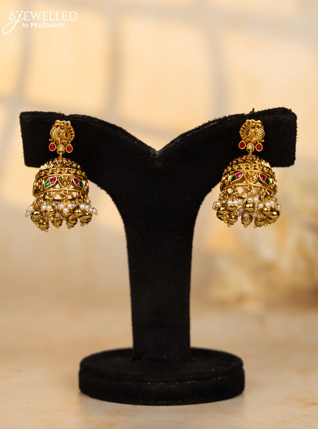 Antique jhumka peacock deisgn in jadau kundan stones and pearl golden ball hangings