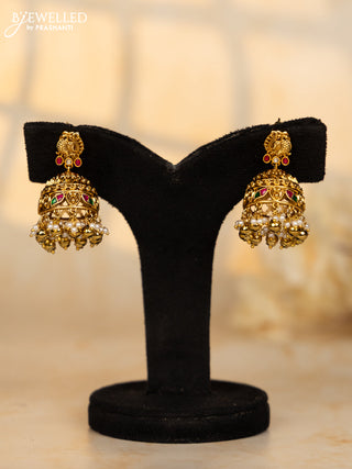 Antique jhumka peacock deisgn in jadau kundan stones and pearl golden ball hangings