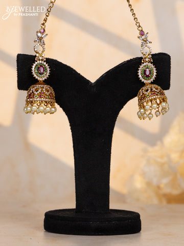 Antique maatal type jhumka in oval design in multicolor stones and pearl hanging