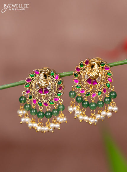 Antique earring peacock deisgn in jadau kundan stones and pearl hanging