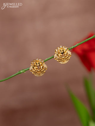 Antique earring with god face in white stones