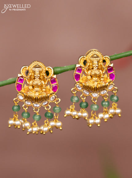 Antique earring lakshmi deisgn in jadau stones in gold finish with pearl hangings