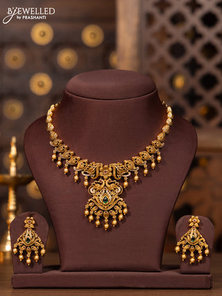 Antique necklace with kemp and cz stones in golden beads hangings