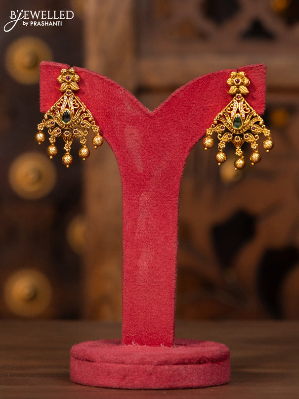 Antique necklace with kemp and cz stones in golden beads hangings