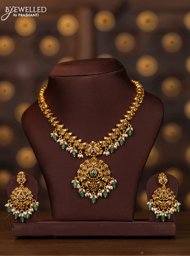 Antique necklace peacock design with kemp and cz stones in pearl & mint green beads hangings