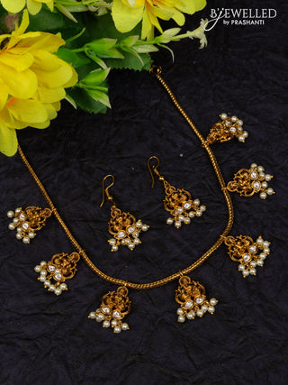 Antique attigai necklace lakshmi design with kundan stones and pearl hangings