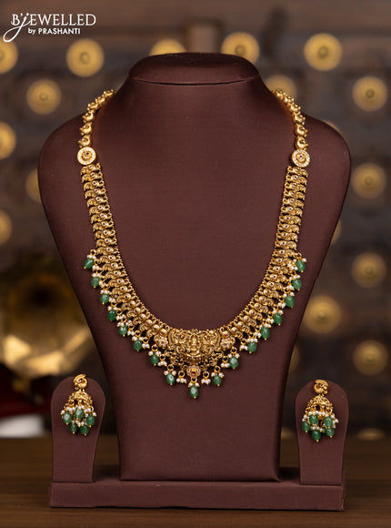 Antique haaram lakshmi design with pink kemp and cz stones in pearl & mint green beads hangings