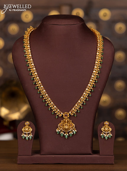 Antique haaram lakshmi pendant with pink kemp and cz stones in mint green beads hangings