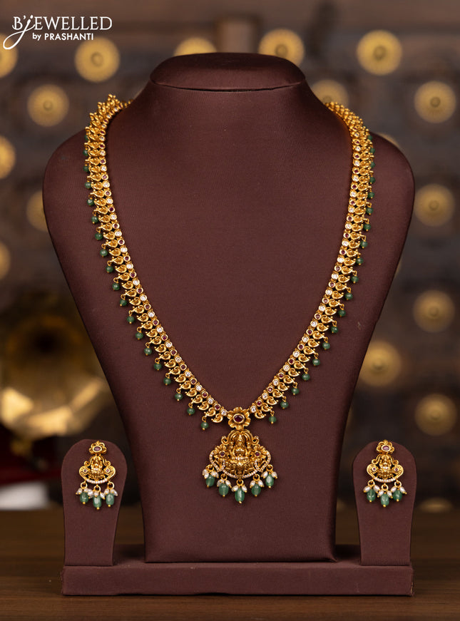 Antique haaram lakshmi pendant with pink kemp and cz stones in mint green beads hangings